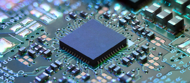 A closeup shot of a computer chip on a mainboard.