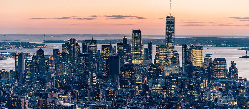 A view of the Manhattan skyline at dusk.