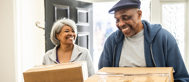 Senior couple redecorating home.