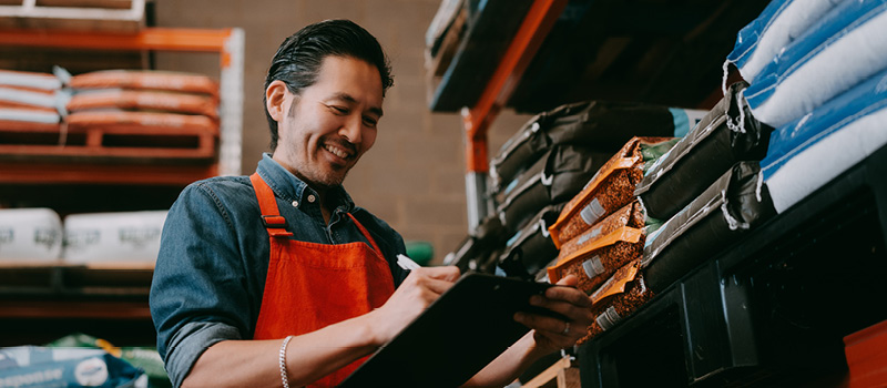 A small business owner reviewing his inventory.