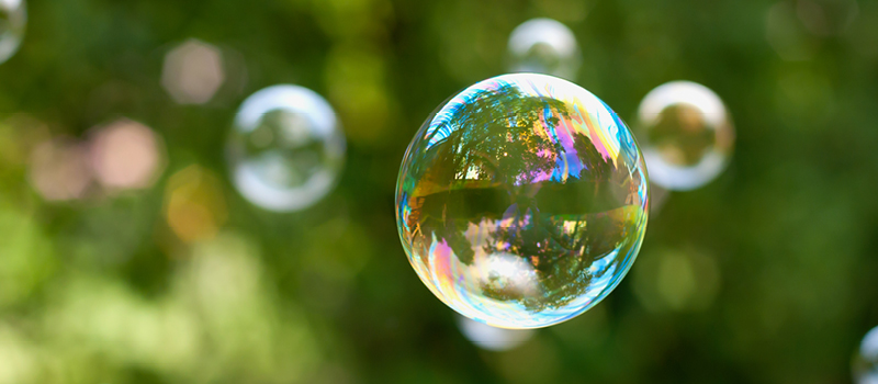 A soap bubble floating in the air.