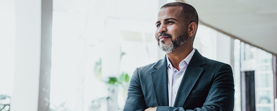 Man looking confidently out the window.