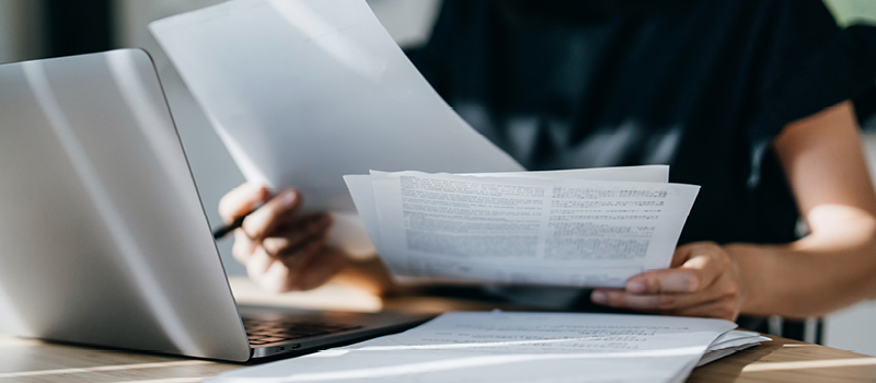 Woman reviewing finances at home.