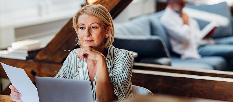 Business woman looking at paper